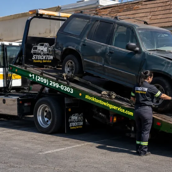 junk removal and towing of suv truck by stockton towing service